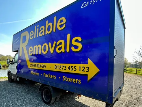 Reliable Removals Luton van showing the Worthing and Shoreham phone numbers