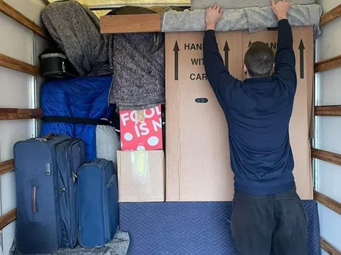 A fully loaded removal van packed floor to ceiling with a house move